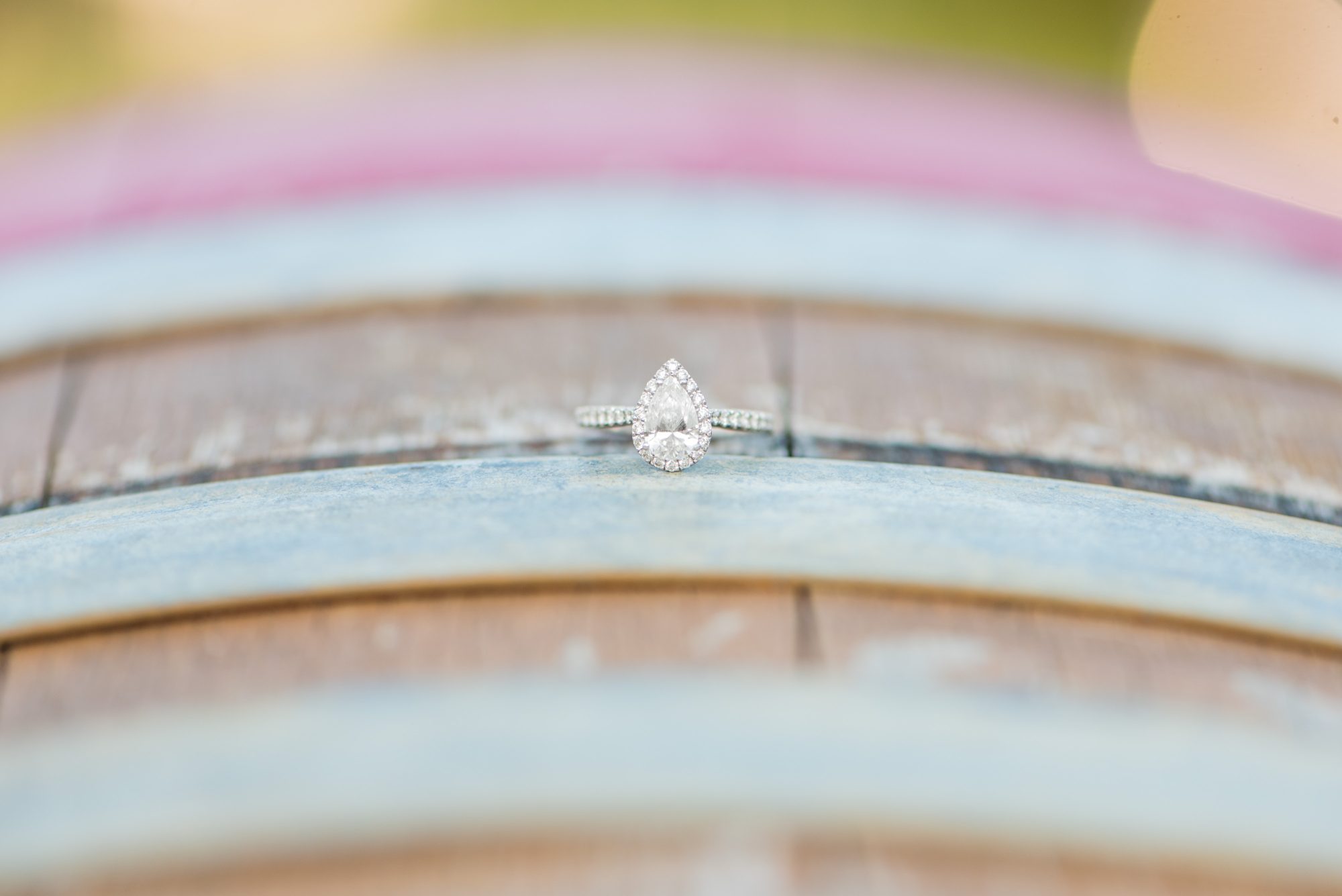 Pear Shaped Engagement Ring on a Wine Barrel